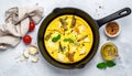 Frying pan with scrambled eggs stuffed with edible yucca flowers.Diet omelet Royalty Free Stock Photo