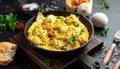 Frying pan with scrambled eggs stuffed with edible yucca flowers.Diet omelet Royalty Free Stock Photo