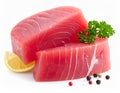 Two thick, raw tuna steaks with a vibrant pink hue are placed against a white background Royalty Free Stock Photo