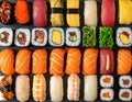 Assorted sushi platter on a dark slate surface. Neatly arranged maki, nigiri, and gunkan Royalty Free Stock Photo