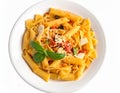 A white bowl filled with mixed pasta types, including rigatoni and farfalle, topped with a tomato-based sauce Royalty Free Stock Photo
