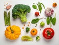 An assortment of fresh vegetables is arranged on a white surface Royalty Free Stock Photo
