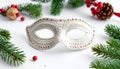 White Crochet Mask with Red Beads and Christmas Decorations Royalty Free Stock Photo
