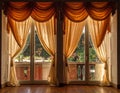 Elegant interior scene featuring large French doors adorned with rich, golden-beige draperies Royalty Free Stock Photo