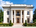 Neoclassical two-story building featuring large columns with Corinthian capitals Royalty Free Stock Photo