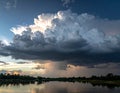 Towering cumulonimbus clouds dominate the sky, with dark gray bases Royalty Free Stock Photo