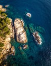 Aerial views of the rocks in the sea on a sunny day in the Costa Brava in Spain Royalty Free Stock Photo