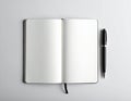 Open notebook with blank, white pages lies on a gray surface Royalty Free Stock Photo