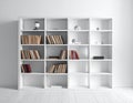 White bookshelf with nine sections arranged in three columns Royalty Free Stock Photo