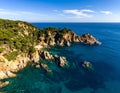 Aerial views of the rocks in the sea on a sunny day in the Costa Brava in Spain Royalty Free Stock Photo