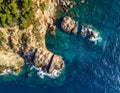 Aerial views of the rocks in the sea on a sunny day in the Costa Brava in Spain Royalty Free Stock Photo