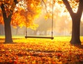 A wooden swing hangs between two trees in a park during autumn Royalty Free Stock Photo