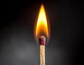 A close-up view of a burning match against a dark background Royalty Free Stock Photo