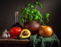 A rustic still life on a wooden table features fresh vegetables and herbs Royalty Free Stock Photo