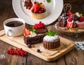 Assortment of desserts arranged on a wooden table Royalty Free Stock Photo