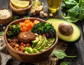 A wooden bowl filled with a variety of colorful vegan ingredients on a rustic wooden table Royalty Free Stock Photo