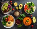 Assorted plant-based dishes arranged on a dark surface Royalty Free Stock Photo