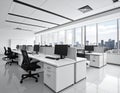 Spacious office interior with a modern design, featuring white desks arranged in rows Royalty Free Stock Photo