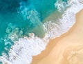 Aerial view of turquoise ocean waves crashing onto a sandy beach Royalty Free Stock Photo