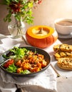 Pumpkin dish with a salad and biscuits Royalty Free Stock Photo