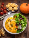 Pumpkin dish with a salad and biscuits Royalty Free Stock Photo