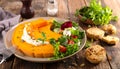 Pumpkin dish with a salad and biscuits Royalty Free Stock Photo