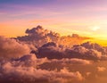 Clouds on a sunset evening with the sun reflecting on them producing an orange pinkis Royalty Free Stock Photo