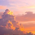Clouds on a sunset evening with the sun reflecting on them producing an orange pinkis Royalty Free Stock Photo
