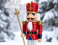 Christmas Nutcracker King wearing crown and holding scepter, snow covered evergreen t Royalty Free Stock Photo