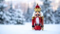 Christmas Nutcracker King wearing crown and holding scepter, snow covered evergreen t Royalty Free Stock Photo