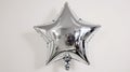 Shiny Silver Star Balloon on White - Celebration, Party, Festive Background Royalty Free Stock Photo