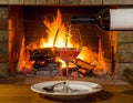 Art pouring wine by the fireplace Royalty Free Stock Photo