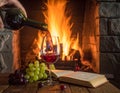 Art pouring wine by the fireplace Royalty Free Stock Photo