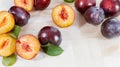 Fresh Plums with Leaves on a Wooden Table - Summer Fruits Royalty Free Stock Photo