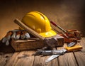 A collection of construction tools displayed on a wooden surface Royalty Free Stock Photo