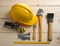 Yellow construction helmet, tape measure, and a variety of tools Royalty Free Stock Photo