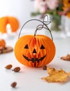 Cute artificial halloween orange pumpkin decoration made from paper and glass Royalty Free Stock Photo