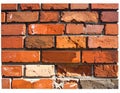 A close-up view of a brick wall made of rectangular red bricks with visible mortar joints Royalty Free Stock Photo