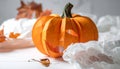 Cute artificial halloween orange pumpkin decoration made from paper and glass Royalty Free Stock Photo