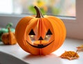 Cute artificial halloween orange pumpkin decoration made from paper and glass Royalty Free Stock Photo