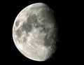 The image shows a detailed view of the Moon, illuminated on the left side Royalty Free Stock Photo
