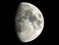 Waxing gibbous Moon against a black sky. The surface is detailed with craters, mountains Royalty Free Stock Photo
