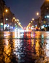Rainstorm night in the big city, light from the shop windows reflected on the road Royalty Free Stock Photo