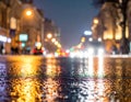 Rainstorm night in the big city, light from the shop windows reflected on the road Royalty Free Stock Photo