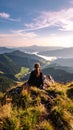 Woman hiker sits and enjoys valley view from viewpoint. Hiker reached top of the moun Royalty Free Stock Photo