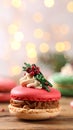 Beautifully decorated Christmas macarons on wooden table against blurred festive Royalty Free Stock Photo