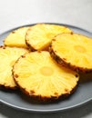 Plate with fresh sliced pineapple, closeup Royalty Free Stock Photo