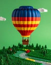 Plastic bricks 3D image of lego hot air balloon on green Royalty Free Stock Photo