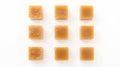 Square Caramel Candies on White Background, Overhead Shot Royalty Free Stock Photo