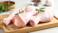 Board with raw chicken drumsticks on table, closeup. Fresh meat Royalty Free Stock Photo